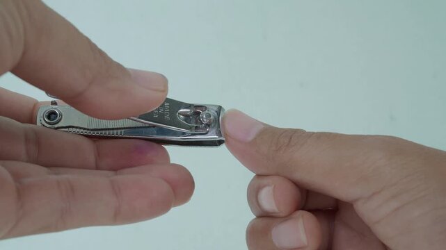 Hand woman and scissour,female trim nail cut fingernail clipper with , body person hygiene thum maicure cosmetic beauty.