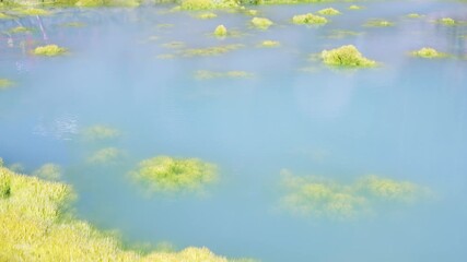 Kamado Jigoku, Bright Blue Sulfur Geothermal Pool Steaming in Beppu, Japan