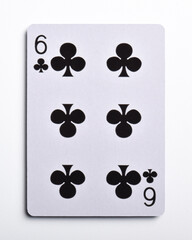 Six of clubs playing card, isolated on white background