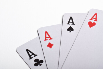 Close up of four aces playing cards suits isolated on white background