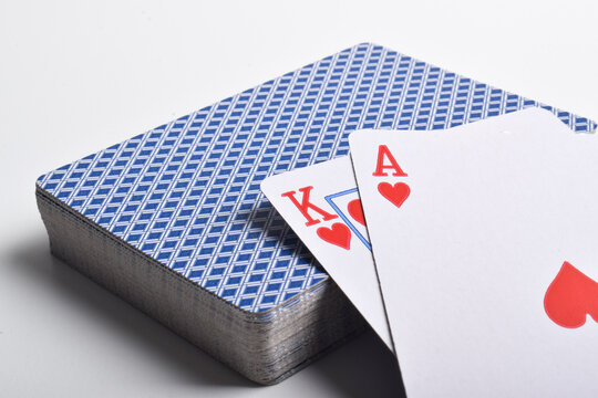 A deck of playing cards with a pair of aces on top isolated on white background - Powered by Adobe