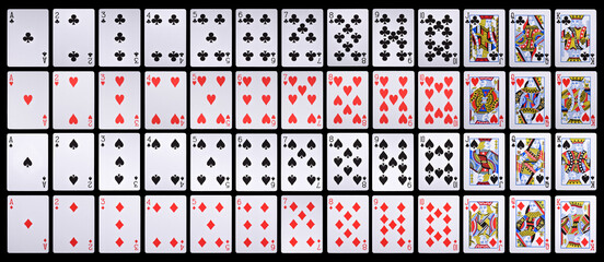 Complete collection of playing cards isolated on black background © Mulad Images