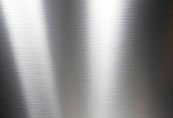 Brushed stainless steel surface with subtle linear grain, reflective highlights,  lines,  metal