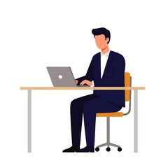 Man in a suit sitting at a desk, working on a laptop computer. He is typing and focused on the screen.