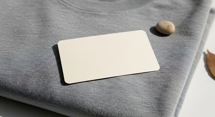 Fototapeta premium Gray Shirt with Business Card and Stone