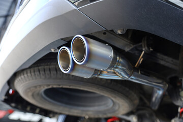 closeup of car exhaust in the garage.