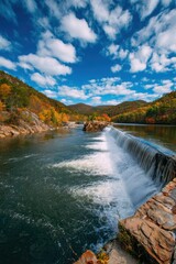 Serene river flowing through lush green landscape under a vibrant blue sky with clouds