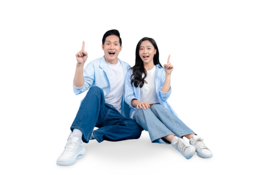 A young couple points upward, with excited and happy expressions on PNG background.