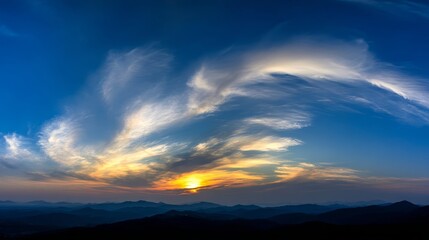 Obraz premium Dramatic panoramic sky with vibrant clouds at sunrise and sunset, wide-angle view with warm and cool color contrast and soft gradient lighting.