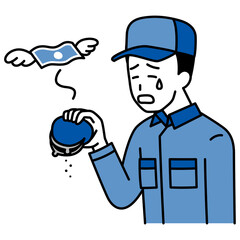 金欠で嘆くつなぎ作業服の男性