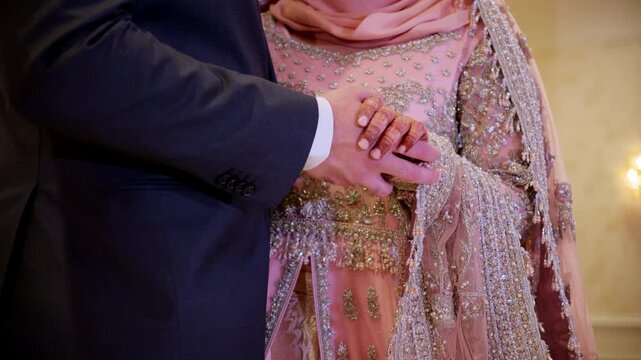 Bride and groom Asian holding Hands during Wedding Photoshoot 