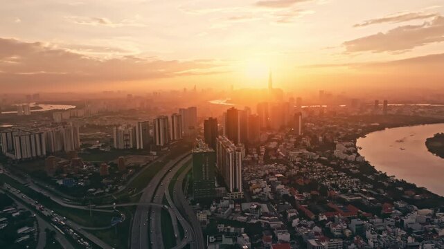 Panoramic view of Saigon, Vietnam from above at Ho Chi Minh City's central business district. Cityscape and many buildings, local houses, bridges, rivers 