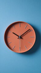 Modern Wall Clock Featuring a Coral Face and Minimalist Design Against a Blue Background in a Contemporary Interior Setting