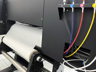Digital technology and industrial equipment combine in a modern printing press to produce...