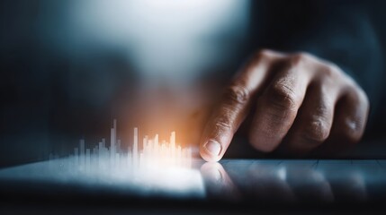 Fingers tapping rising graph on digital tablet for interactive investing