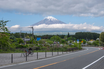 Scenic view of Mount Fuji with road and bicycles in rural Japan, view from Shiraito park