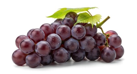 Fototapeta premium Fresh Bunch of Ripe Red Grapes with Green Leaves Isolated on White Background