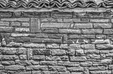 Stone wall background in black and white close up view