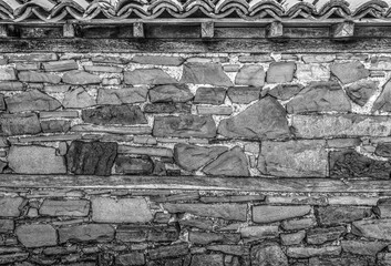 Stone wall background in black and white close up view