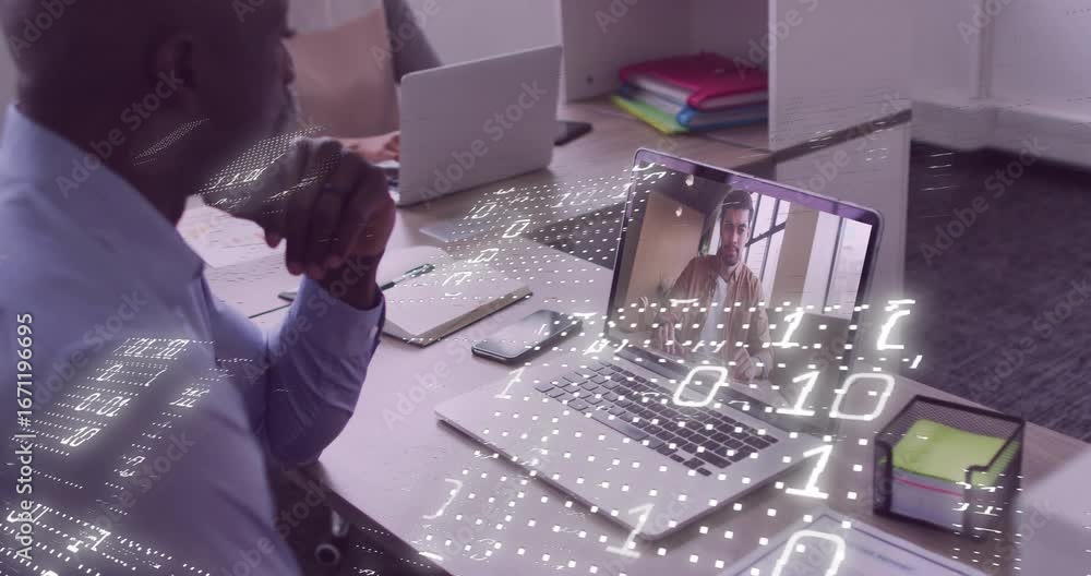 Poster on-site man on tech call focusing on laptop, remote gesturing activating binary grid across desk