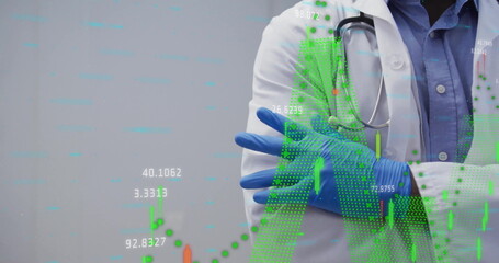 Standing doctor crossing arms at clinic, with stethoscope, lab coat, blue latex gloves, copy space