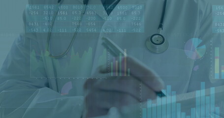 Mature physician tapping tablet and analyzing data in clinic, with stethoscope and charts