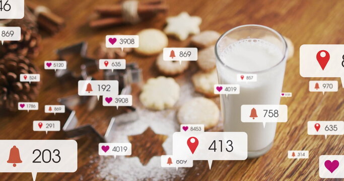 Showing tall glass of milk standing on kitchen table with star cookies, floating icons, copy space - Powered by Adobe