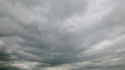 Dramatic Cloudy Sky featuring Layers of Various Gray Clouds Creating a Unique Atmosphere