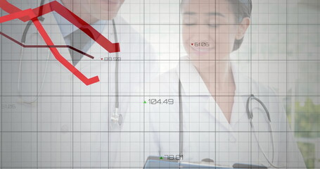 Analyzing doctors reviewing metrics on digital tablet in clinic, with stethoscopes and grid overlay