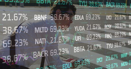 Pausing Asian man wearing eyeglasses, with satchel on crosswalk, checking phone with stock overlays