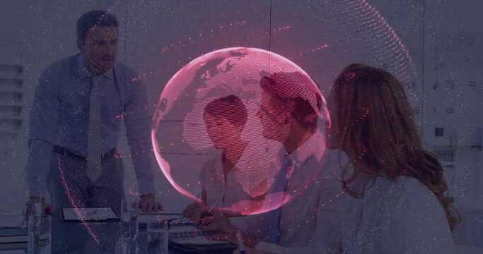 Displaying red translucent 3D globe overlay above conference room table, with laptop documents