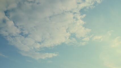 The sky is a beautiful canvas decorated with soft clouds as the day transitions to dusk