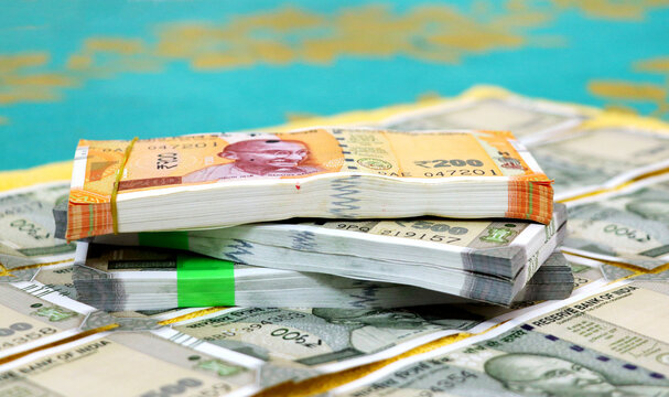 piles of new indian currency notes rupees 50,100,200 and 500