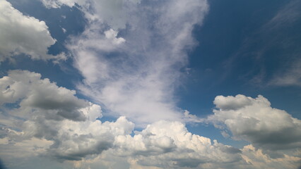 A Beautiful, Dreamy Cloudy Sky with a Stunning Blue Background Illuminates the Landscape