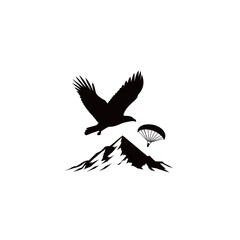 Obraz premium An eagle flies majestically above a snow-capped mountain, while a parachutist descends gracefully from the sky, showcasing the beauty of nature and adventure.
