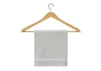 Isolated gray cotton towel on a wooden clothes hanger, close-up of soft terrycloth textile