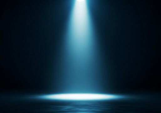 Bright blue spotlight illuminating a dark stage with reflective surface