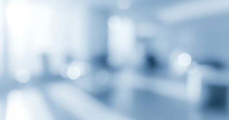 Abstract blurred blue and white background depicts an office or waiting room, creating a professional and modern atmosphere that feels clean, minimal, and suitable for corporate