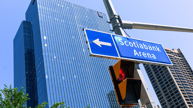 Scotiabank Arena sign with modern skyscraper in Toronto, showcasing urban architecture and vibrant city life, ideal for sports and entertainment themes