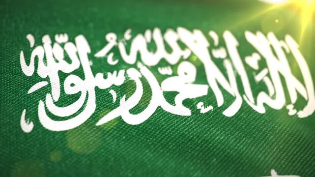 Saudi Arabia Flag Waving with Golden Sun Flare.