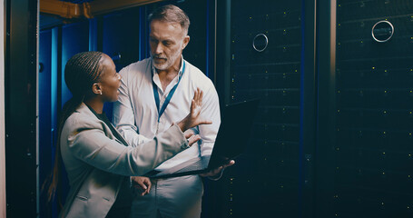 People, laptop and server room with cyber security, maintenance and inspection with engineering. IT...