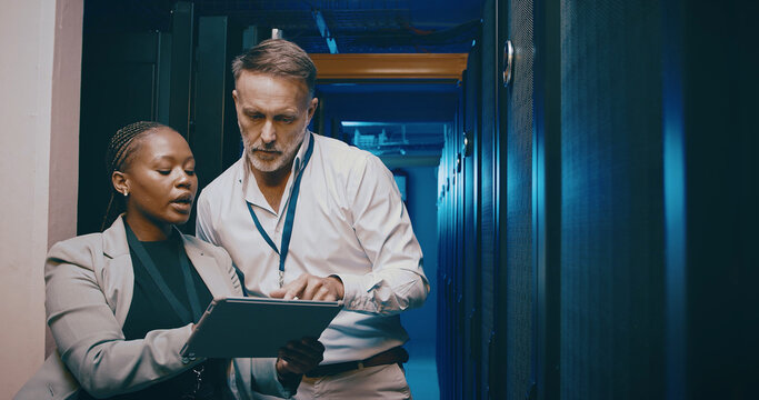 Tablet, team and people in data center for cybersecurity, system upgrade or IT. Discussion, tech and engineer in server room for network diagnostics, planning maintenance or ai training with mentor