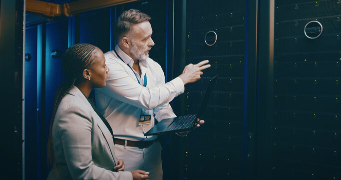 Laptop, team or people in datacenter for planning, backup or IT training with intern. Collaboration, tech or engineer in server room for maintenance, cloud computing or help manager with data storage