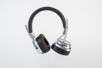 Two-tone silver and brown wireless headphones, Headphones isolate on white background. Wireless headphones in brown.
