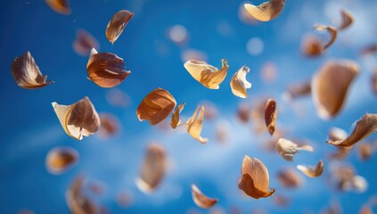 Light brown garlic cloves float against a vibrant blue sky
