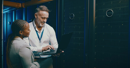 Collaboration, laptop and upgrade with people in server room together for network administration....