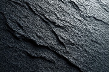 Dark gray stone surface with textured patterns