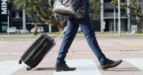 Feet, suitcase and walking with businessman in city for commute, journey or travel to location....
