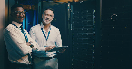 Portrait, tablet and men in server room, cyber security and teamwork with engineering. IT...