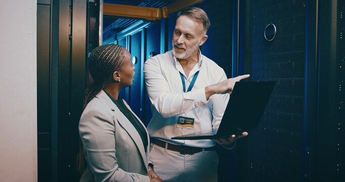 Explain, laptop and upgrade with people in server room together for network administration. Computer, cybersecurity and problem solving with tech support team in data center for firewall maintenance